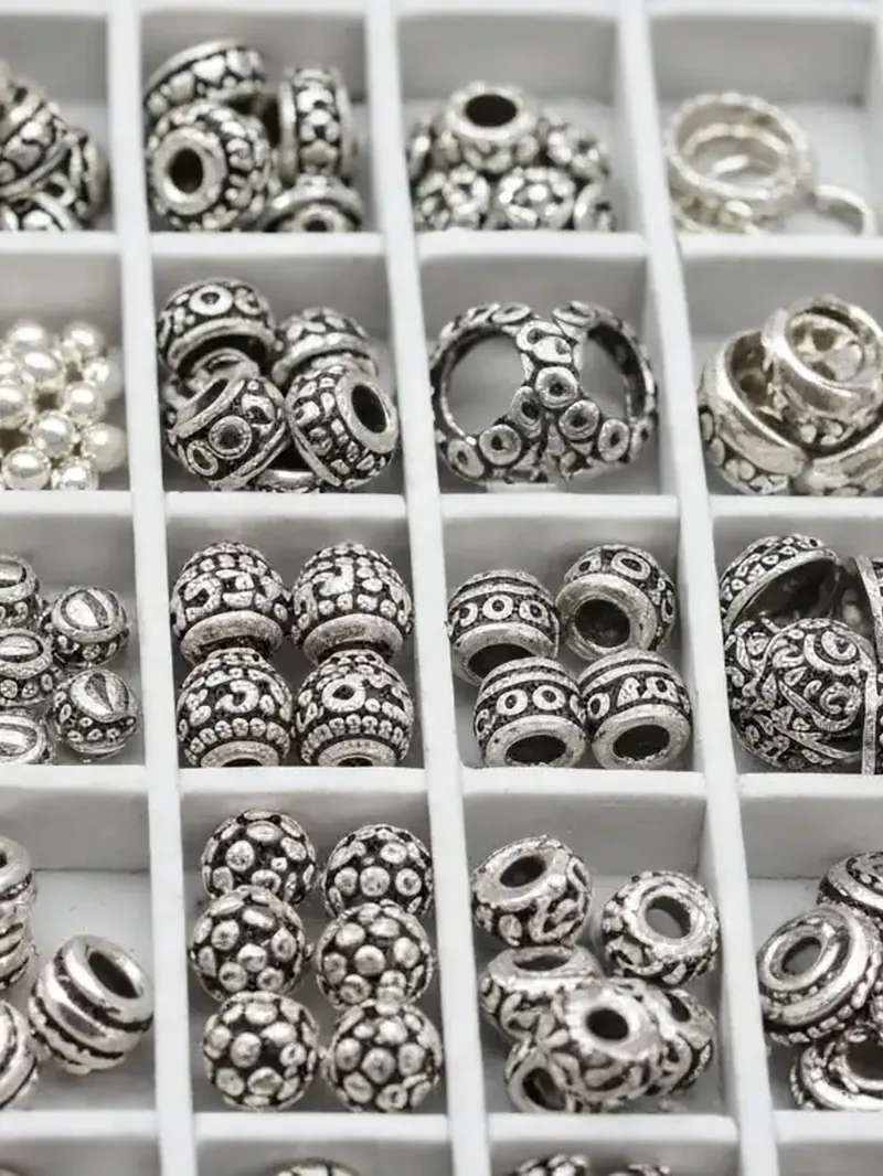 Tray of silver beads and findings
