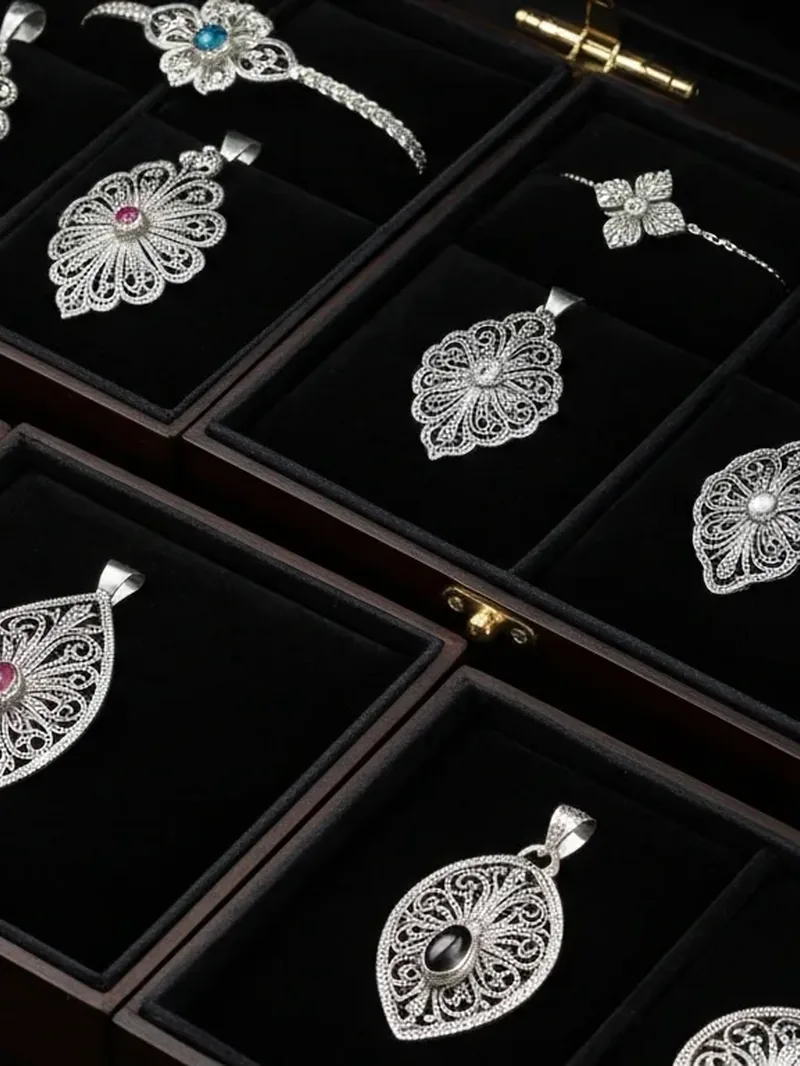 Filigree silver jewelry in a display case