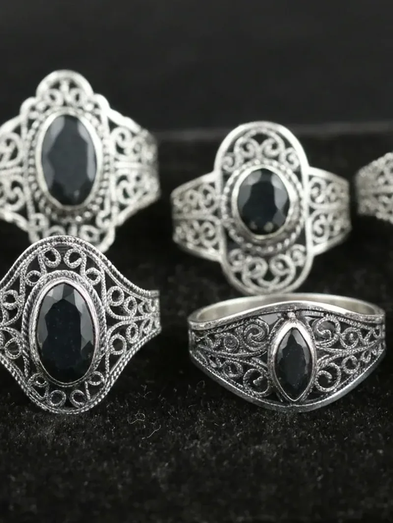Sterling silver filigree rings set with dark faceted stones